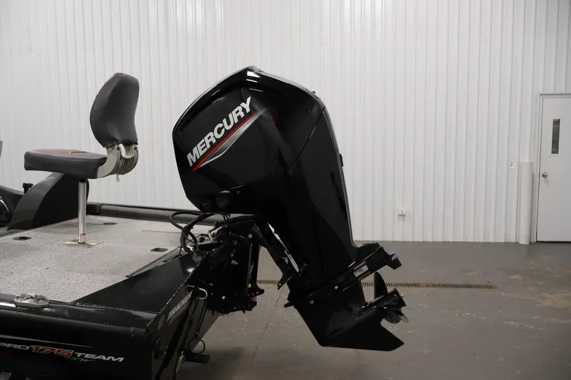 Slide: The Image of 2022 Tracker Pro Team 175 TXW boat with Mercury outboard motor in a garage. - 41