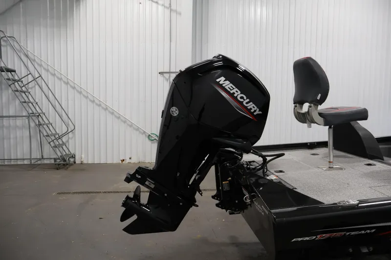 Slide: The Image of 2022 Tracker Pro Team 175 TXW boat with Mercury outboard motor in a garage. - 42