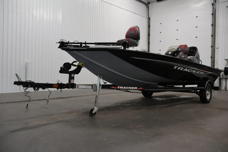 Slide: The Image of 2022 Tracker Pro Team 175 TXW boat on trailer in indoor setting. - 46