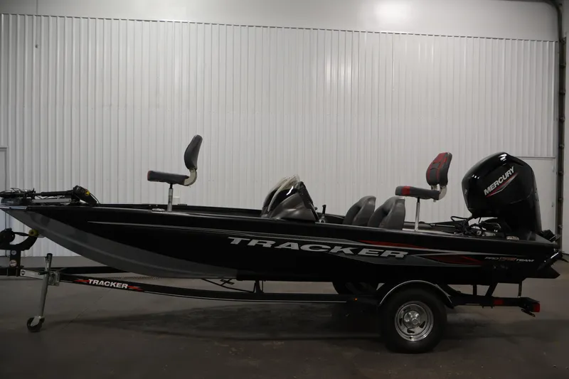 Slide: The Image of 2022 Tracker Pro Team 175 TXW fishing boat on trailer in indoor setting. - 8