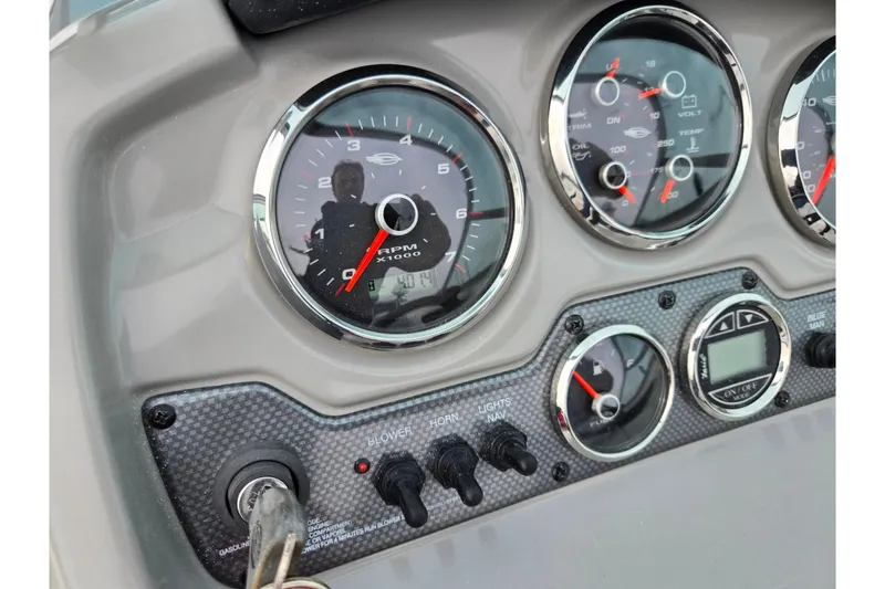 Slide: The Image of Dashboard of a 2016 Chaparral 19 H2O Sport boat with gauges and controls. - 26