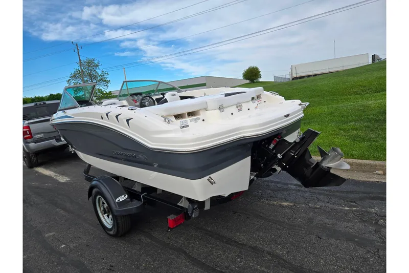 Slide: The Image of 2016 Chaparral 19 H2O Sport boat on trailer, parked outdoors. - 3