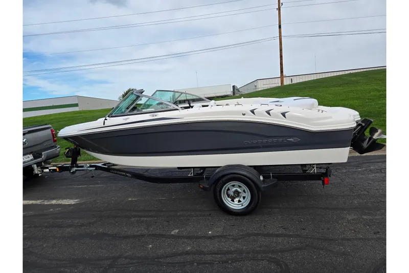 Slide: The Image of 2016 Chaparral 19 H2O Sport boat on trailer, parked outdoors. - 4