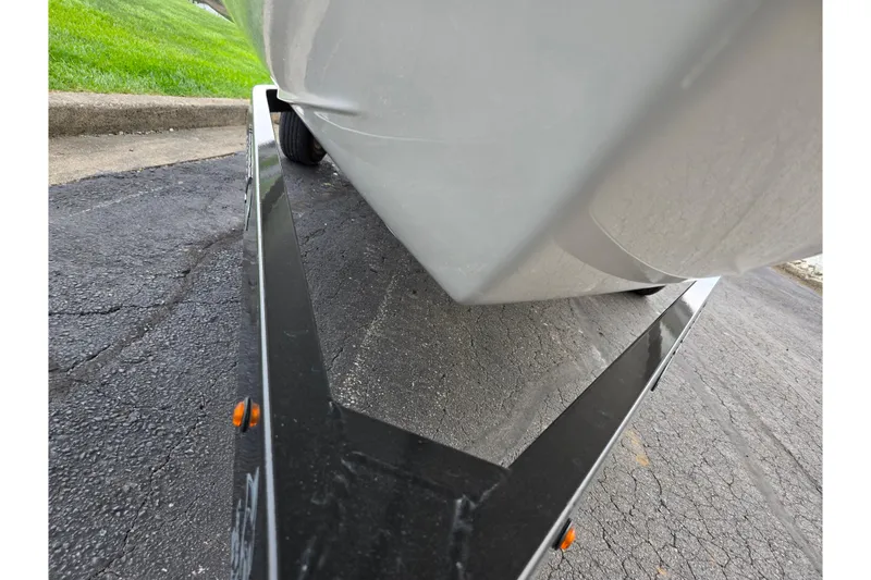 Slide: The Image of 2016 Chaparral 19 H2O Sport boat on trailer, close-up view from below. - 7