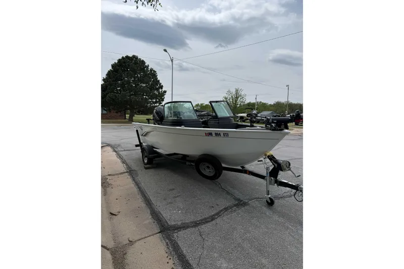 The Image of 2020 Lund 1775 Adventure Sport boat on trailer, parked on a street. - 1