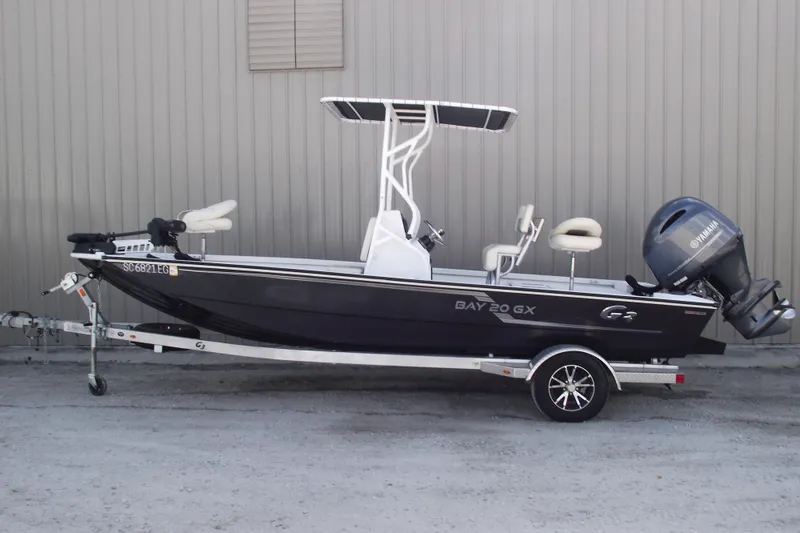The Image of 2023 G3 Bay 20 GX boat with Yamaha motor on trailer, side view. - 0