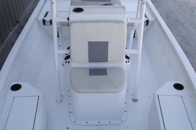 Slide: The Image of 2023 G3 Bay 20 GX boat interior with white seating and storage compartments. - 12