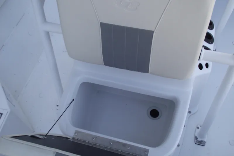 Slide: The Image of 2023 G3 Bay 20 GX boat interior with storage compartment and cushioned seat. - 13