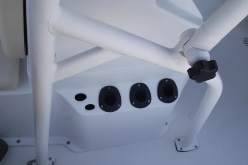 Slide: The Image of 2023 G3 Bay 20 GX boat interior with rod holders and white framework. - 14