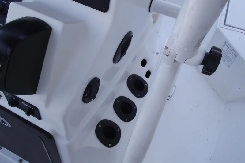 Slide: The Image of 2023 G3 Bay 20 GX boat console with control panel and rod holders. - 15