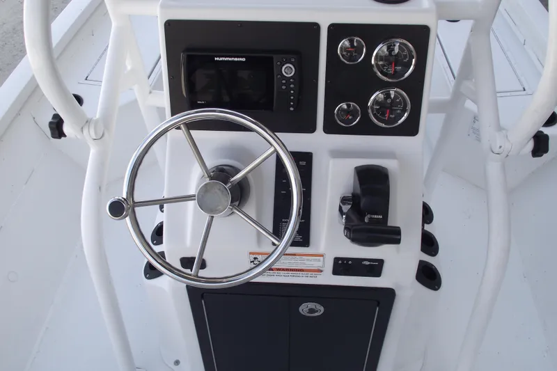 Slide: The Image of 2023 G3 Bay 20 GX boat console with steering wheel and controls. - 16