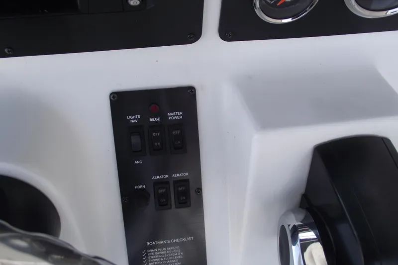 Slide: The Image of Control panel of 2023 G3 Bay 20 GX boat with switches and gauges. - 18