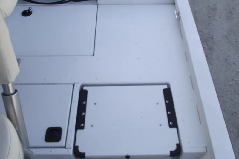 Slide: The Image of 2023 G3 Bay 20 GX boat deck with storage compartments and seating. - 20