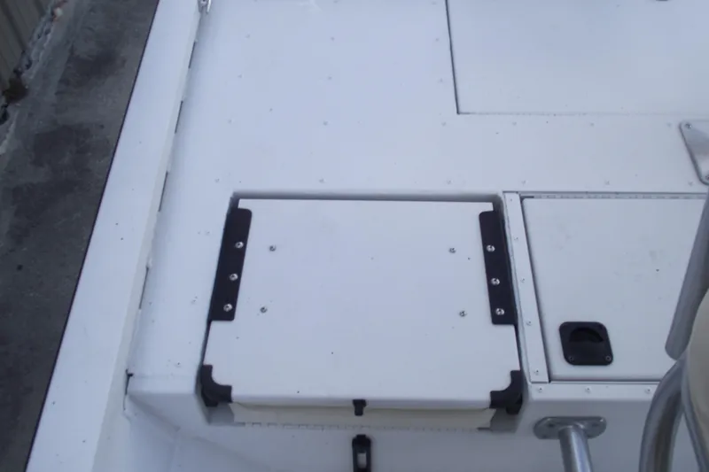 Slide: The Image of 2023 G3 Bay 20 GX boat deck with storage compartments and seating area. - 23
