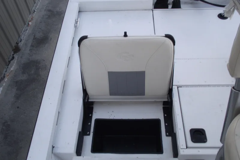 Slide: The Image of 2023 G3 Bay 20 GX boat seat with storage compartment open. - 25