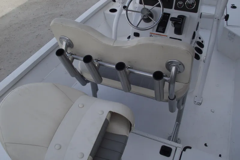 Slide: The Image of 2023 G3 Bay 20 GX boat interior with steering console and rod holders. - 30
