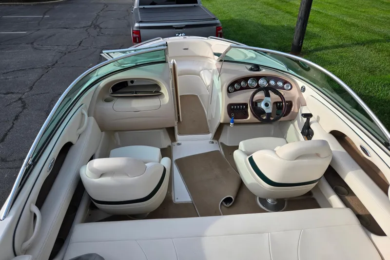 Slide: The Image of Interior of a 2000 Chaparral 186 SSi boat with beige seating and dashboard. - 10