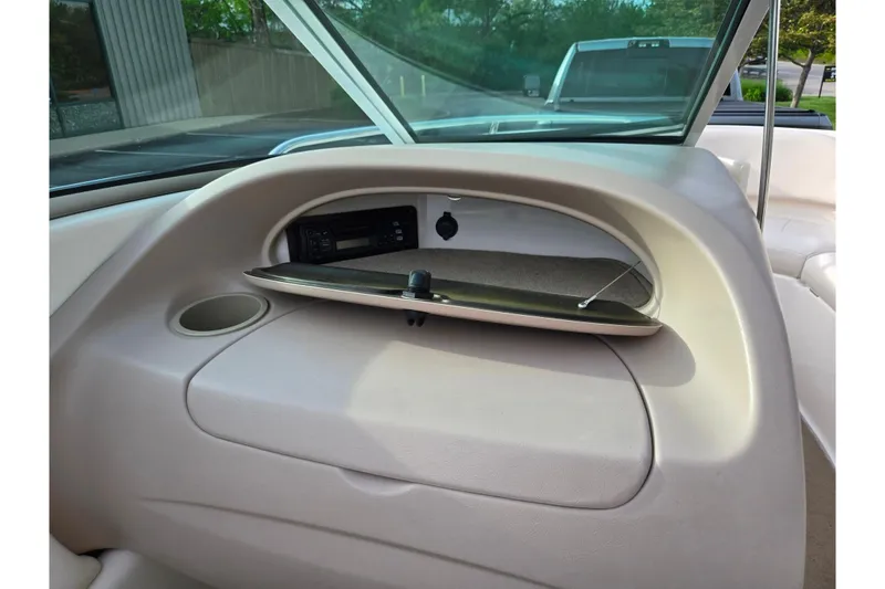 Slide: The Image of Interior view of a 2000 Chaparral 186 SSi boat dashboard with storage compartment. - 12