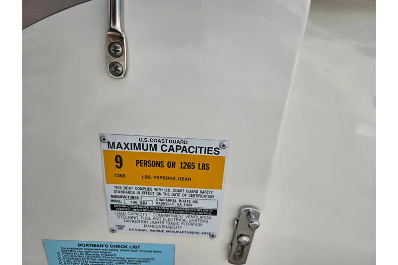 Slide: The Image of Chaparral 186 SSi 2000 boat capacity label, 9 persons or 1265 lbs limit. - 13