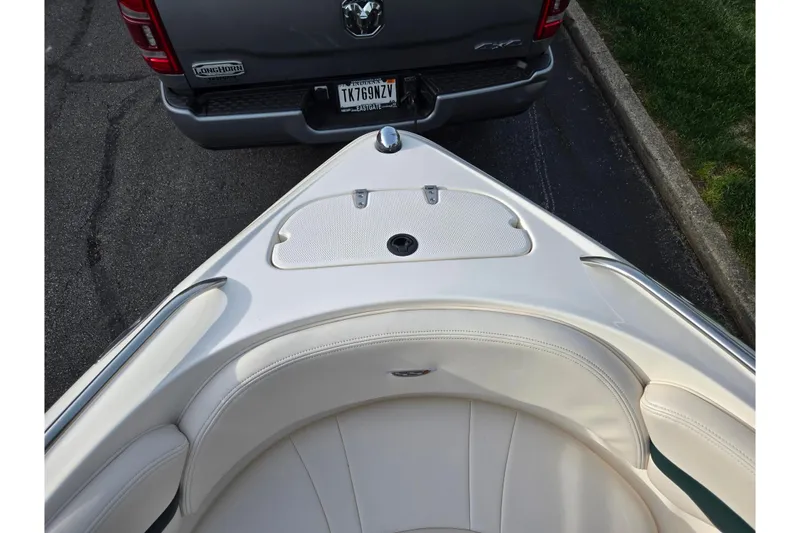 Slide: The Image of Bow of 2000 Chaparral 186 SSi boat near a parked truck. - 16