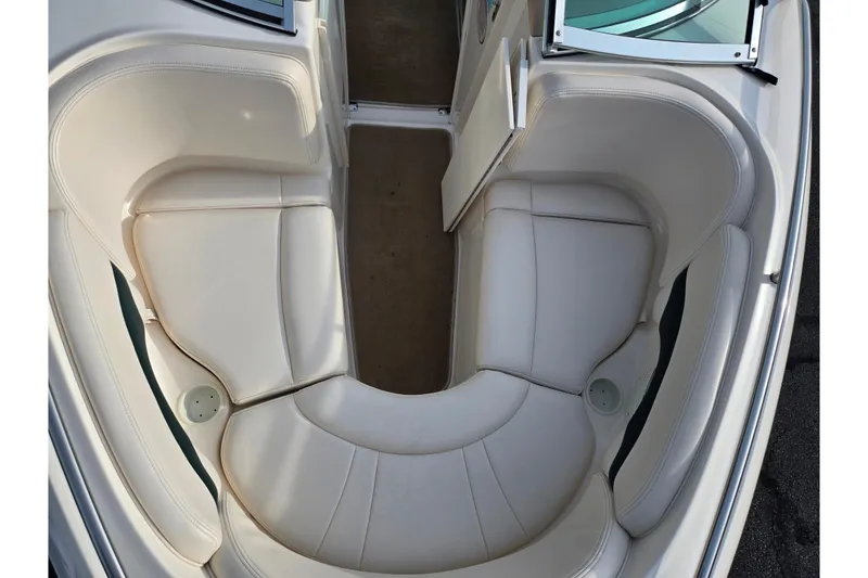 Slide: The Image of 2000 Chaparral 186 SSi boat interior with white cushioned seating and open windshield. - 17