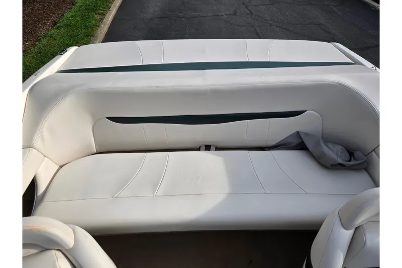 Slide: The Image of White leather seating in a 2000 Chaparral 186 SSi boat interior. - 20