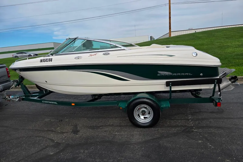 Slide: The Image of 2000 Chaparral 186 SSi boat on trailer, parked outdoors. - 4