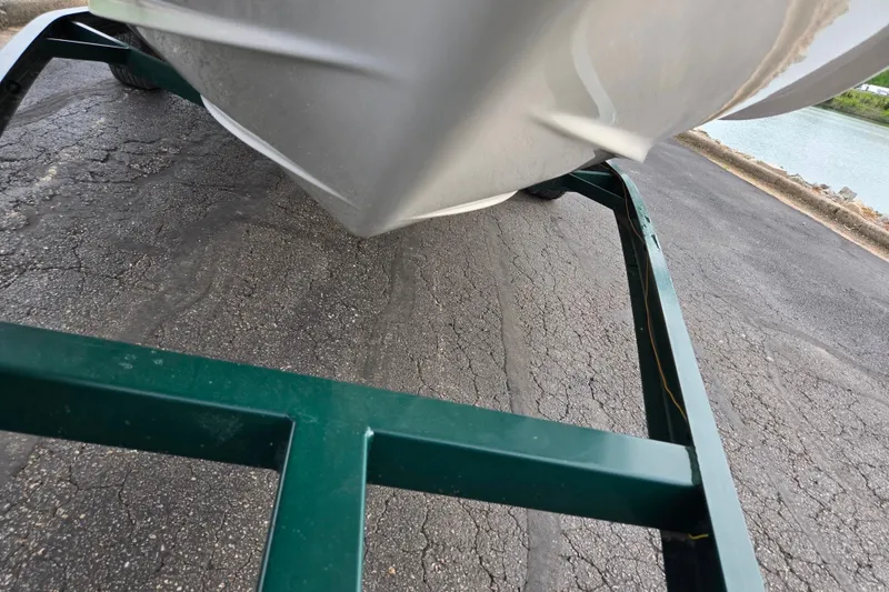 Slide: The Image of Chaparral 186 SSi boat on trailer, close-up view, parked near water. - 7