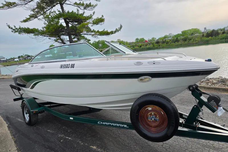 Slide: The Image of Chaparral 186 SSi 2000 boat on trailer by a lakeside, ready for launch. - 8