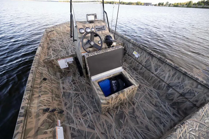 Slide: The Image of Manufacturer Provided Image: 2026 Crestliner 1660 Retriever FCC boat with camouflage design on a lake. - 4