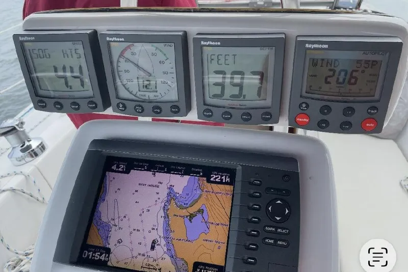 Slide: The Image of Sailing instruments on a 2001 Catalina 36 MkII, displaying speed, depth, and navigation data. - 10