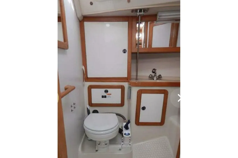 Slide: The Image of Bathroom interior of 2001 Catalina 36 MkII sailboat with toilet and sink. - 15
