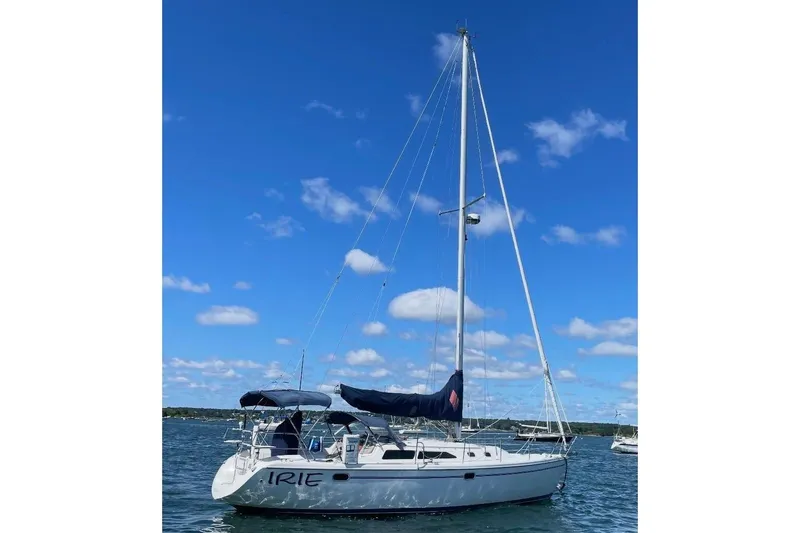 Slide: The Image of 2001 Catalina 36 MkII sailboat on water under clear blue sky. - 2