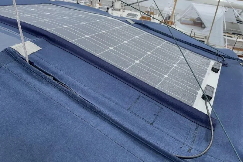Slide: The Image of Solar panel on 2001 Catalina 36 MkII sailboat deck, surrounded by blue canvas. - 5