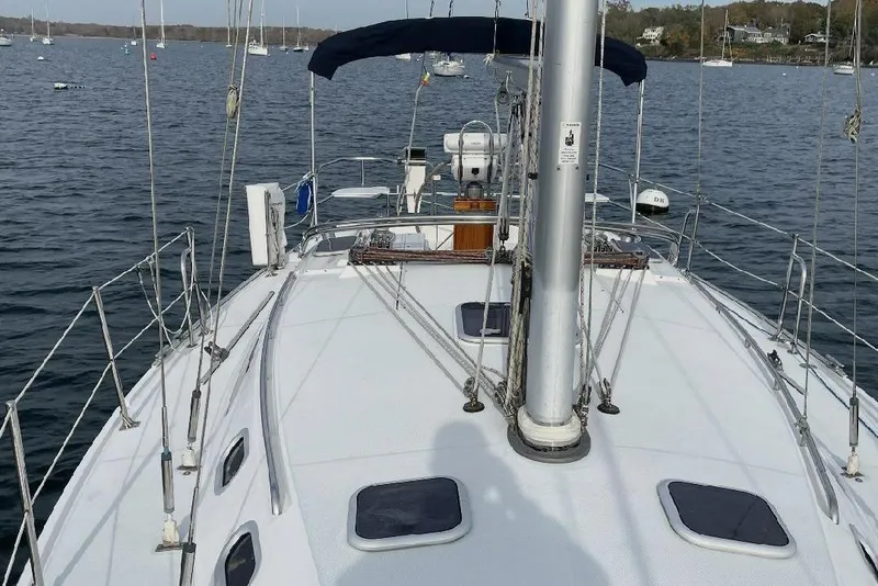 Slide: The Image of Sailboat Catalina 36 MkII 2001 on calm water, showcasing deck and rigging. - 7