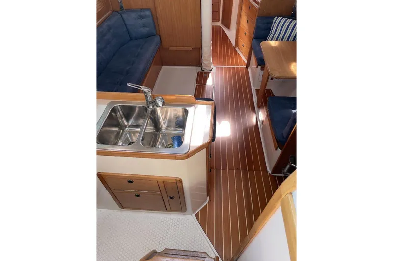 Slide: The Image of Interior of 2001 Catalina 36 MkII sailboat with wood flooring and dual sink. - 8