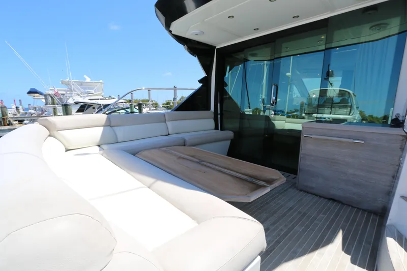 Slide: The Image of Luxurious 2019 Beneteau Gran Turismo 50 yacht interior with plush seating and sleek design. - 14