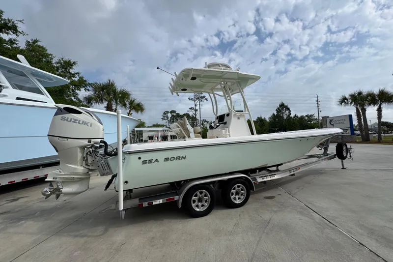 Slide: The Image of 2019 Sea Born FX25 Bay boat on trailer with Suzuki outboard motor. - 11