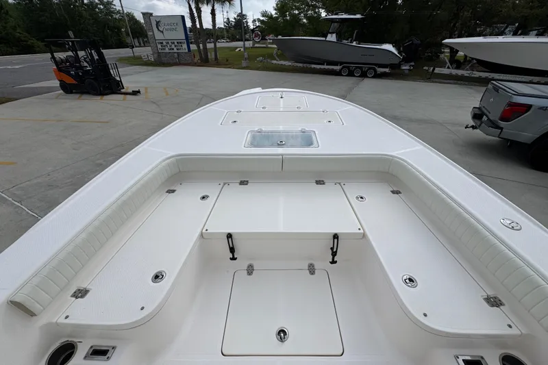 Slide: The Image of 2019 Sea Born FX25 Bay boat deck with storage compartments and seating. - 18