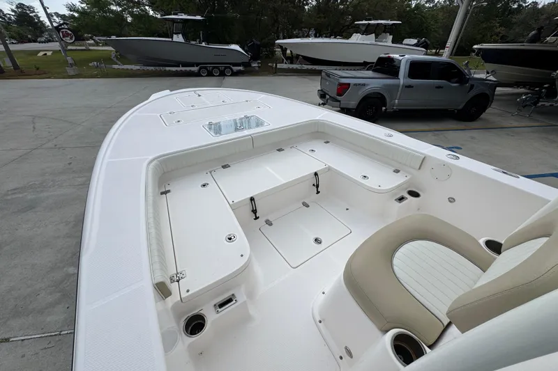 Slide: The Image of 2019 Sea Born FX25 Bay boat interior with seating and storage compartments. - 19