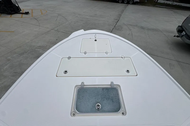 Slide: The Image of Bow of a 2019 Sea Born FX25 Bay boat with storage compartments. - 20
