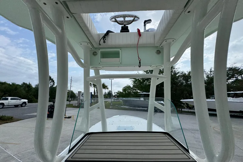 Slide: The Image of 2019 Sea Born FX25 Bay boat interior with T-top and steering console. - 31