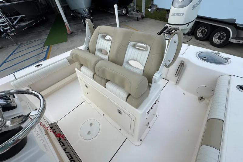 Slide: The Image of 2019 Sea Born FX25 Bay boat interior with dual beige and white seats. - 32