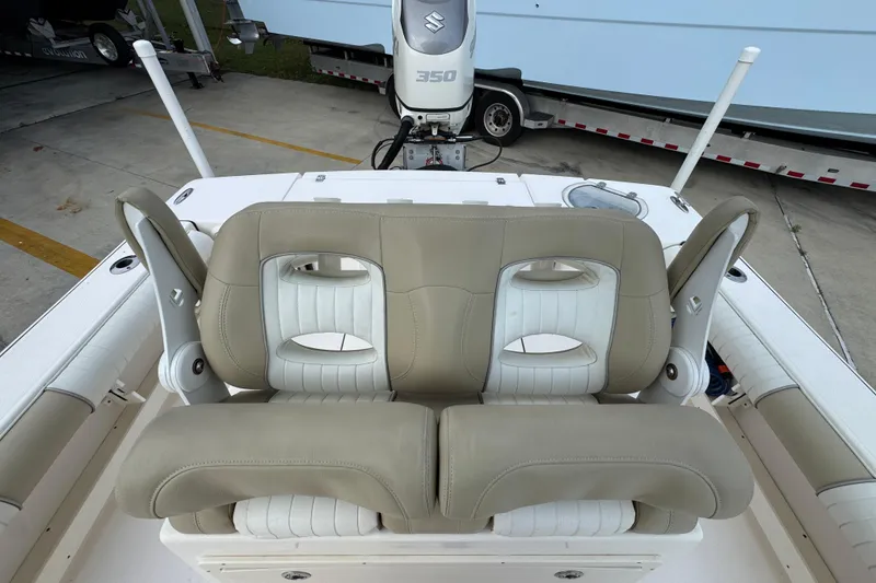 Slide: The Image of 2019 Sea Born FX25 Bay boat with dual beige and white cushioned seats. - 33
