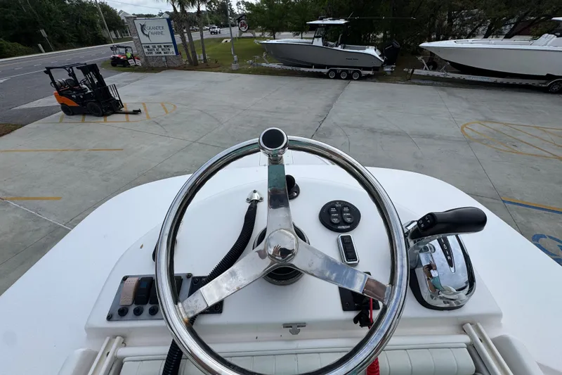 Slide: The Image of 2019 Sea Born FX25 Bay boat steering wheel and controls on display. - 35