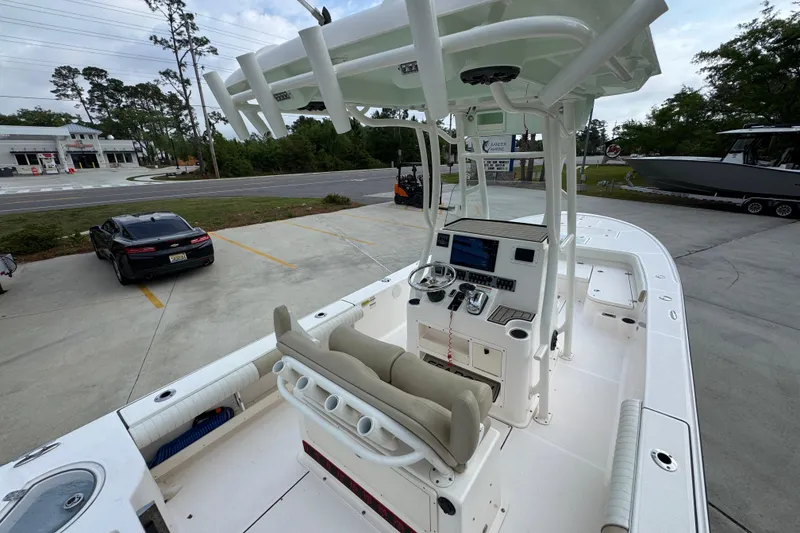 Slide: The Image of 2019 Sea Born FX25 Bay boat with center console and seating, parked outdoors. - 37