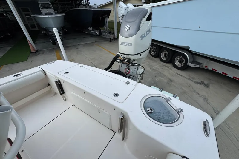 Slide: The Image of 2019 Sea Born FX25 Bay boat with Suzuki 350 outboard motor in a marina setting. - 39