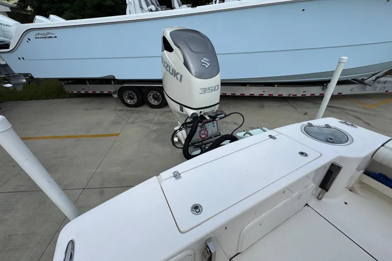 Slide: The Image of 2019 Sea Born FX25 Bay boat with Suzuki 350 outboard motor in a marina. - 41