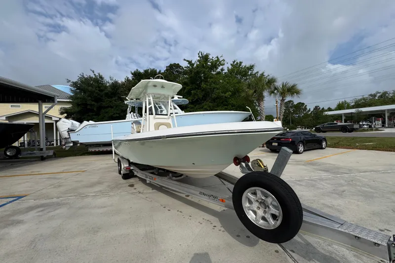 Slide: The Image of 2019 Sea Born FX25 Bay boat on trailer in parking lot. - 7
