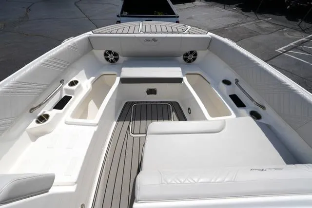 Slide: The Image of 2025 Sea Ray SDX 270 boat interior with spacious seating and modern design. - 10